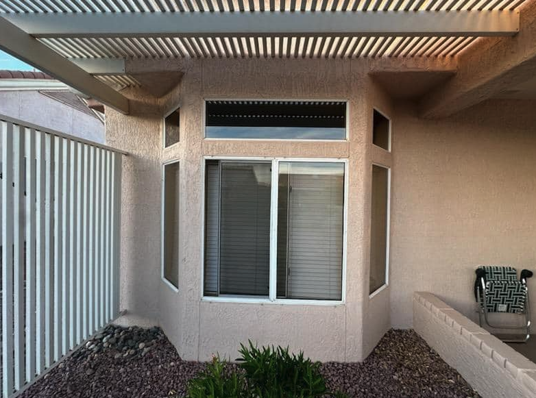 Sliding window cleaned under a covered patio in Bee Cave